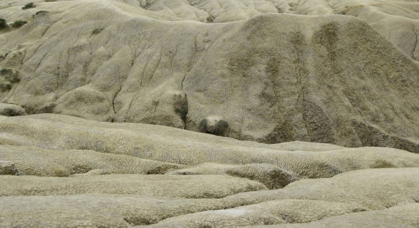 istock Global warming. Cracked soil with dust and rough texture of the dry surface. Drought lack of water in the field (Climate change) 1282542664