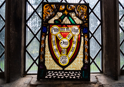 Stained glass panel on a church windowsill