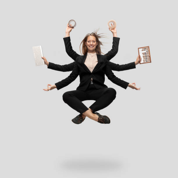 Beautiful business woman, secretary, multi-armed manager levitating isolated on grey studio background Beautiful business woman, secretary, multi-armed manager levitating isolated on grey studio background. Multi-task worker like Shiva. Concept of business, deadline, balance, time management. lord shiva stock pictures, royalty-free photos & images
