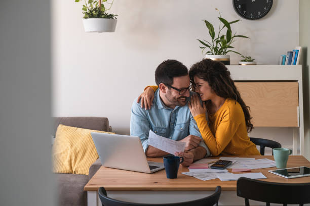 istock Embraced couple manage home finance together 1282544148