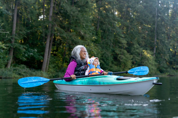 istock Ethnic grandmother kayaking with grandchild 1282545523
