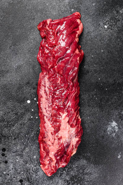 istock Raw top blade, Denver steak. Black background. Top view. 1282546685