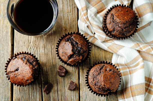 istock Chocolate chips oats chocolate muffins with coffee 1282547046