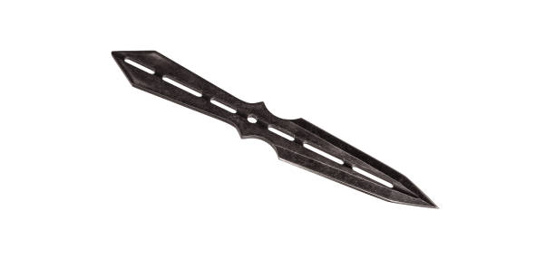 istock Double-edged throwing knife isolate on a white background. Knife made of solid, dark metal pieces. Ninja weapons. 1282549068