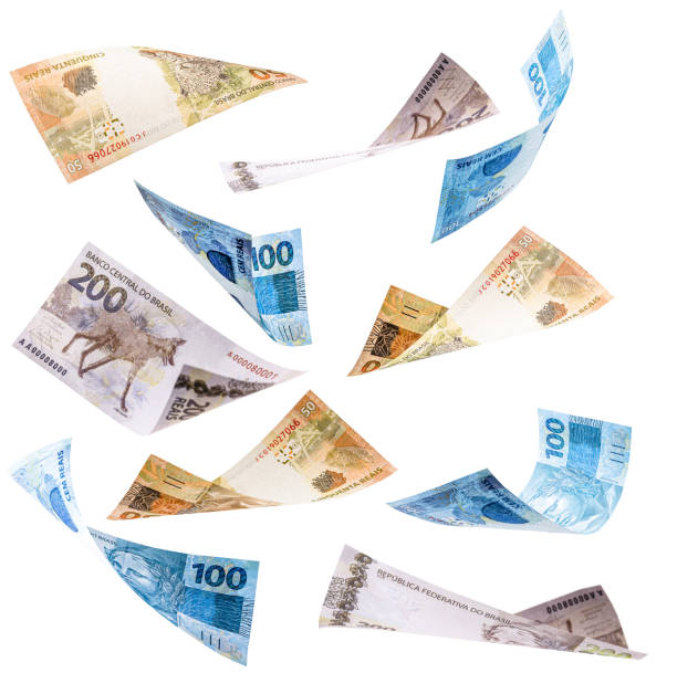 many banknotes from brazil falling on white background, two hundred, one hundred and fifty reais in free fall stock photo