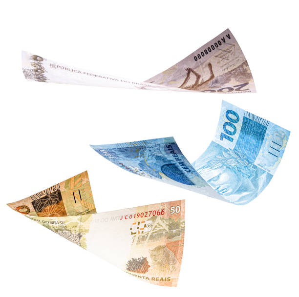 istock two hundred, one hundred and fifty reais notes in fall, isolated white background. Concept of big loss, inflation and devaluation 1282549513