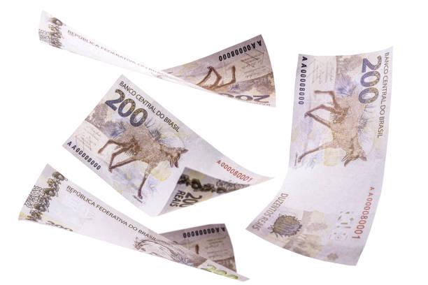 istock two hundred reais banknotes from brazil falling on isolated white background, new banknote from brazil 1282549517