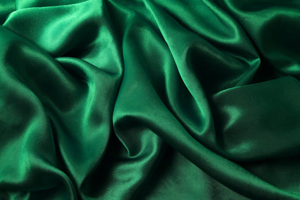 istock drapery of green glossy fabric 1282549546