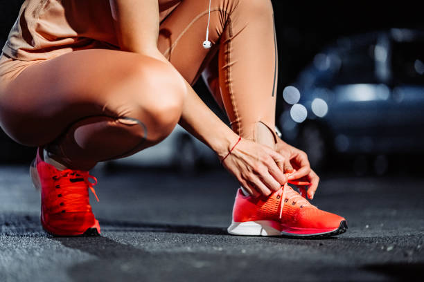 istock Tying shoelace on running shoes before practice 1282549579