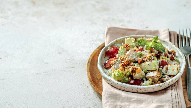 Waldorf salad on gray cement, copy space