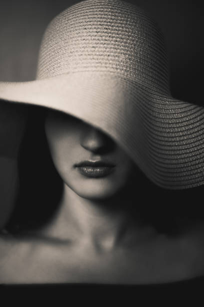 istock Beautiful elegant woman with oversized hat 1282551145