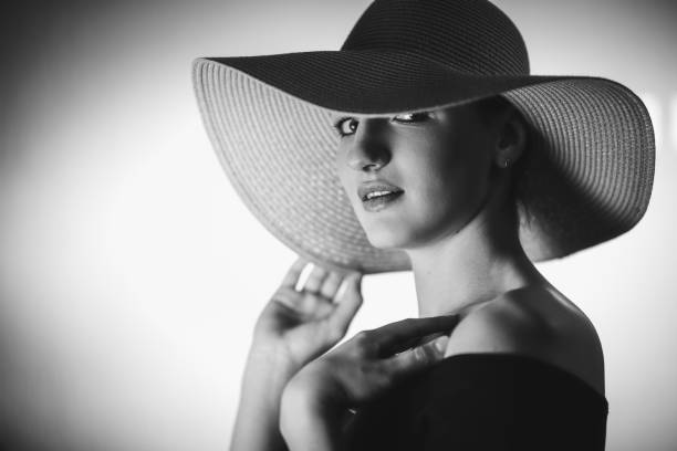 istock Beautiful elegant woman with oversized hat 1282551708