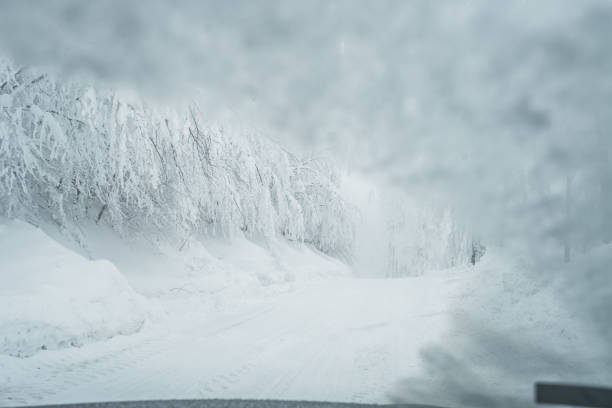 istock Driving on snow covered road 1282553262