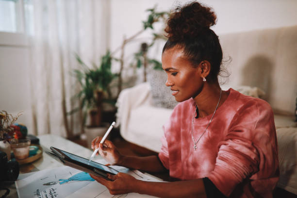 istock Female designer working at home on a digital tablet 1282553445
