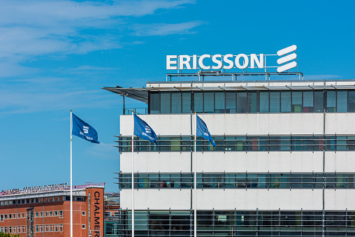 Gothenburg, Sweden - August 06 2020: Ericsson logo and flags at their Lindholmen office.