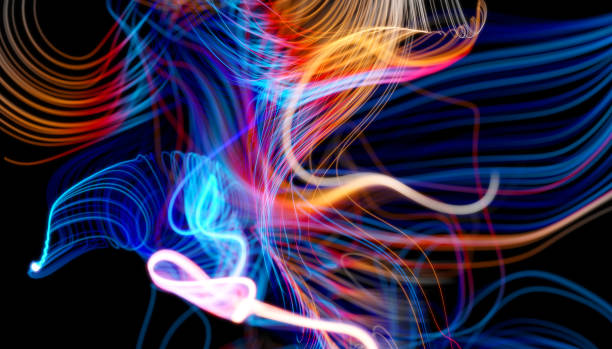 istock 3d abstract art 3d background with surreal wavy curve organic neon glowing light lines pattern in blue and orange gradient color with depth of field effect on black back 1282554938