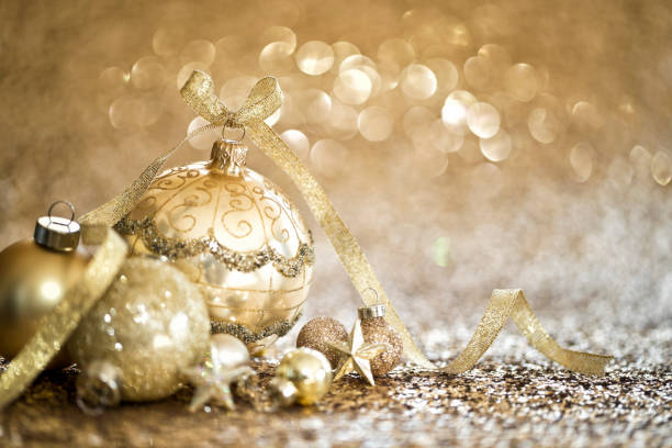 istock Christmas Gold Baubles on a Gold Background 1282555032