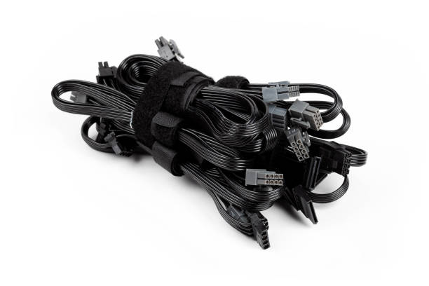 istock Black modular power supply unit cables set, psu cords put together isolated on white. Many power cables, modern pc assembly parts. Cable management concept, product photo 1282556969