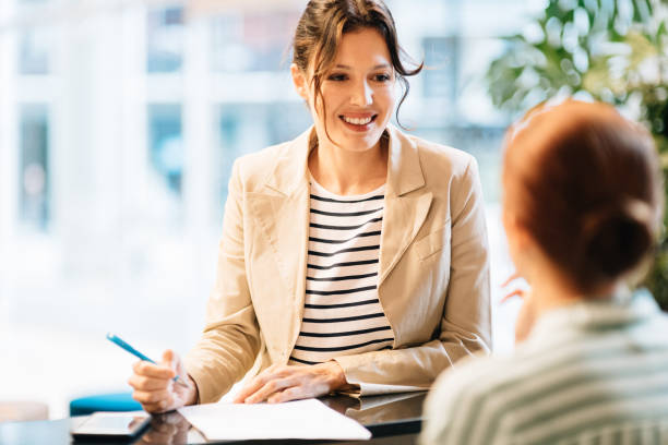 istock Businesswoman checking in at Hotel Reception 1282559661