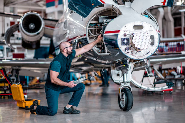 istock Male engineer working on jet engine in the hangar 1282559763