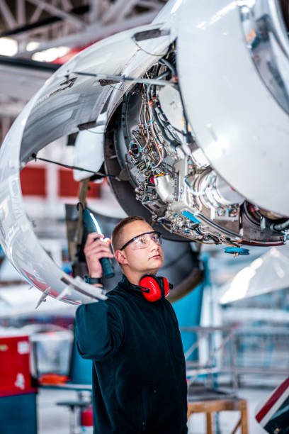 istock Young male engineer checking the airplane jet 1282560675