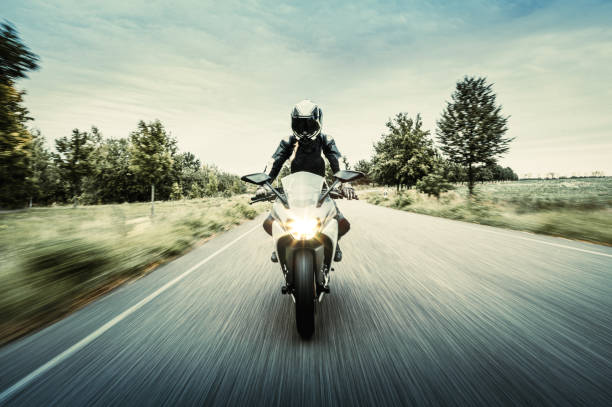Motorcycle in blurred motion stock photo