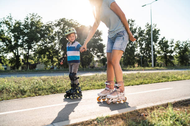 istock Mom and son ride a roller skates 1282563083