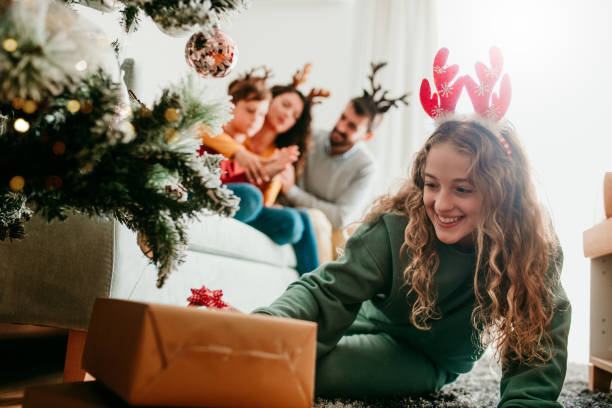 Arranging the presents under the Christmas Tree