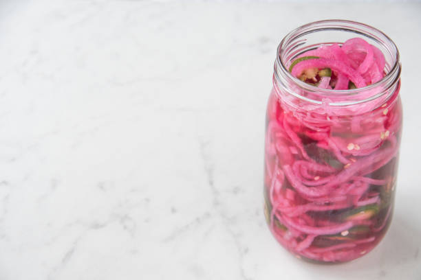 istock Jar of Pink Pickled Red Onions and Jalapenos 1282564683