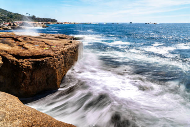 istock Scenery waves hitting the rock at Bicheno Blowhole Beach, Tasmania, Australia 1282565921