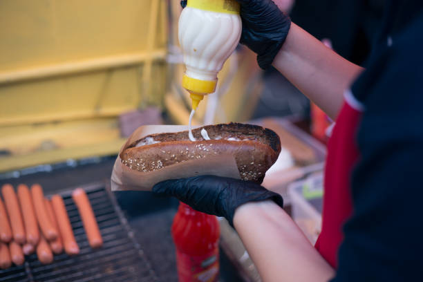 istock Delicious fresh hot dogs on the grill 1282566107