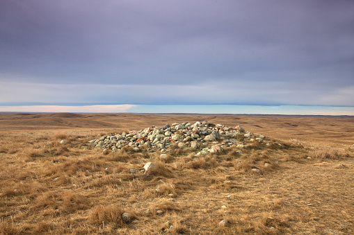 An ancient medicine wheel on the prairie. This is a historic sundial or medicine wheel on the great plains. This is the Majorville Medicine Wheel, which is only accessible via a 20 kilometer trail.