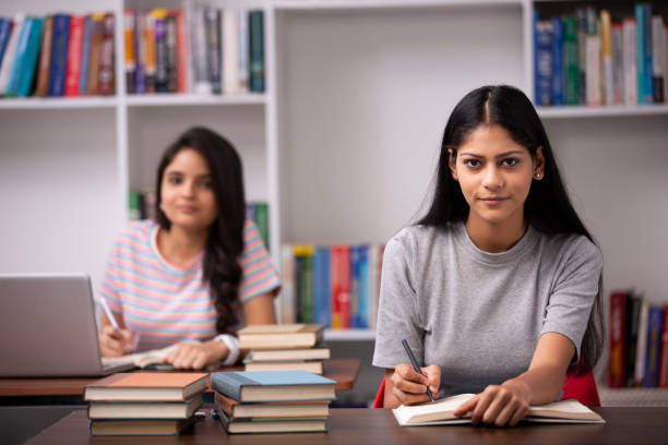 istock Adult Student in library - stock photo 1282568416