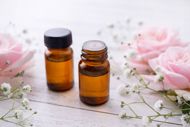istock Essential oil and pink rose. Aromatherapy image. 1282571620