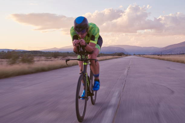 istock triathlon athlete riding a  bike 1282574346