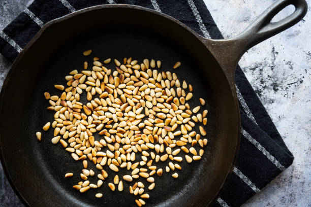 istock Toasted Pine Nuts in a Cast Iron Skillet 1282578224