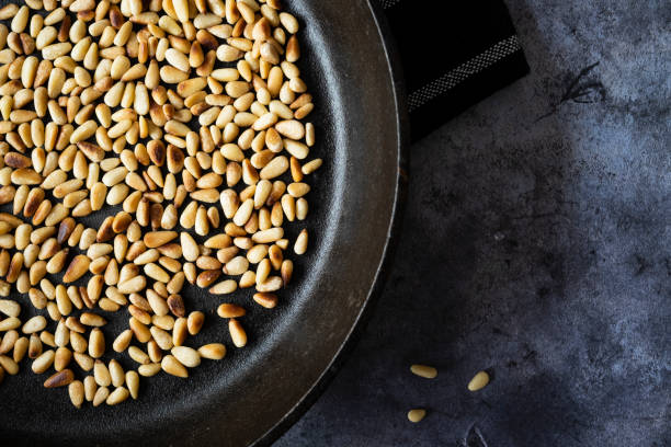istock Toasted Pine Nuts in a Cast Iron Skillet 1282578291
