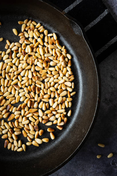 istock Toasted Pine Nuts in a Cast Iron Skillet 1282578313