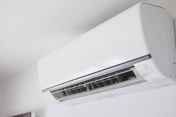 istock Air conditioner on white wall room interior background 1282579493