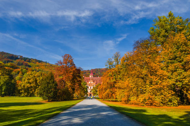 Graz, Austria-October 14, 2019: Eggenberg Palace and colorful autumn colors in the park. Selective focus
