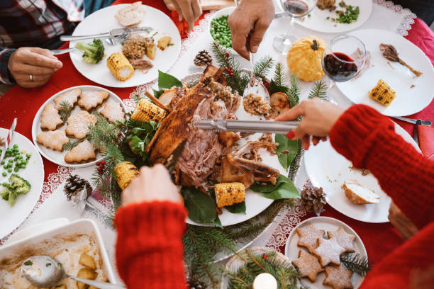 istock Woman hand cutting Christmas meal. 1282580548