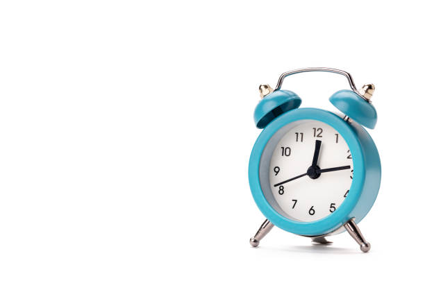 istock old blue alarm clock isolated on a white background. copy space. studio shot. time symbol. schedule concept 1282581800
