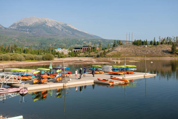 Recreation area at Dillon reservoir in summer Frisco, Colorado, USA - August 25th, 2020: Kayaking during pandemic. People in face masks are waiting for their kayak at Dillon reservoir recreation area frisco colorado stock pictures, royalty-free photos & images