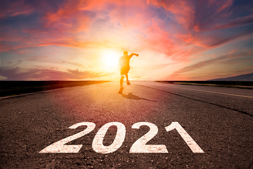 man running and sprinting on road with celebration 2021 new year concept