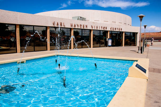 Visitor Centre at Lake Powell which is a man-made reservoir on the Colorado River, straddling the border between Utah and Arizona It is the second largest man-made reservoir in the United States behind Lake Mead, storing 24,322,000 acre feet of water when full. Lake Powell was created by the flooding of Glen Canyon by the controversial Glen Canyon Dam page arizona stock pictures, royalty-free photos & images