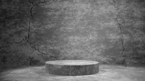 istock Concrete cylinder stand on gray wall background 1282588162