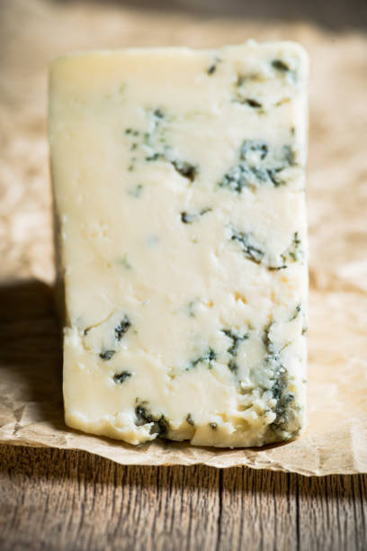 istock Tasty blue cheese on the rustic background 1282588188