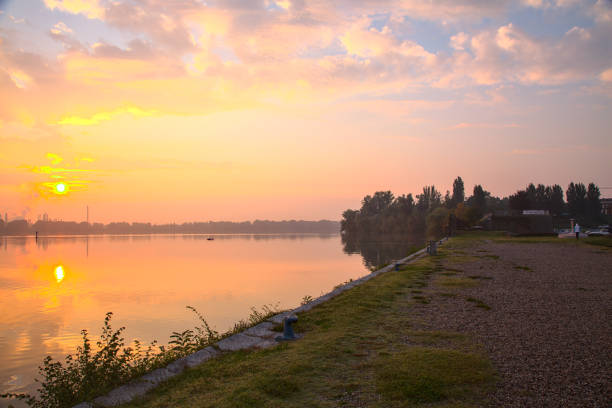istock Sunrise over a lake in autumn with some mist 1282588212
