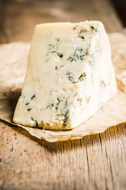istock Tasty blue cheese on the rustic background 1282588253