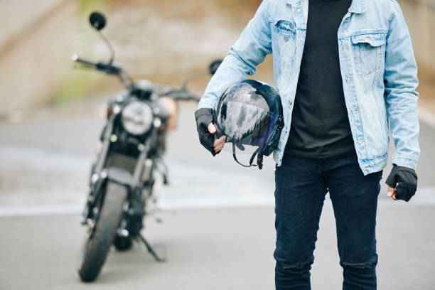 istock Motorcyclist with helmet 1282589524